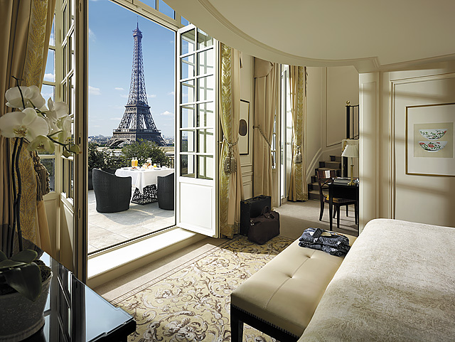 Deluxe Eiffel Tower Suite at Shangri-La Paris with sweeping views of the Eiffel Tower through ornate French windows